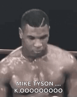 Man Without Shirt Talking To Mike Tyson GIF