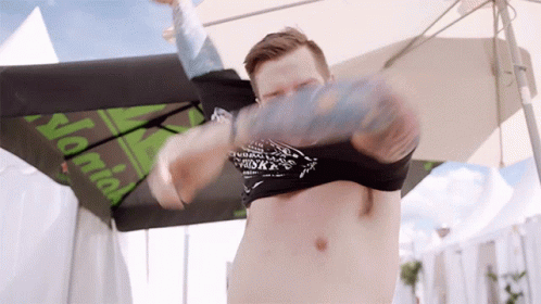Man Without Shirt Under Umbrella Saying Normal GIF
