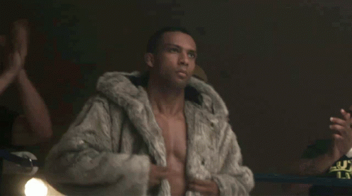 Man Without Shirt Wearing Fur Coat GIF