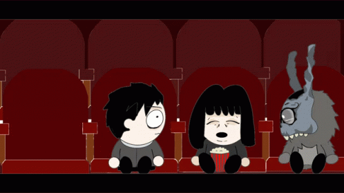 Man Woman And Stuffed Animal In Theater GIF