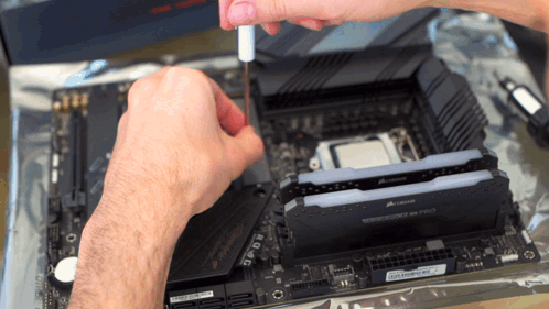 Man Working on Motherboard With Corsair RAM