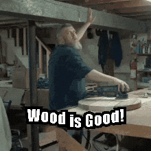 Man Working on Wood Saying Wood Is Good