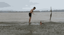 Man Working Out At Sea Side Burpee Exercise GIF