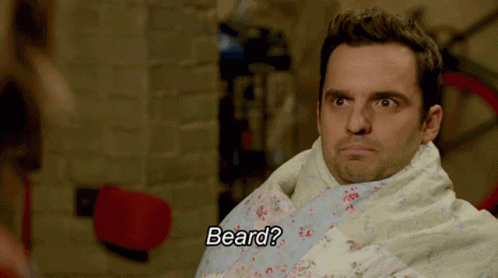 Man Wrapped in Blanket With Beard