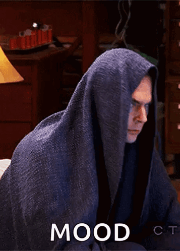Man Wrapped in Blanket With Mood