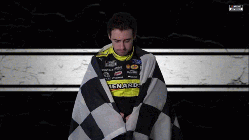 Man Wrapped In Checkered Flag In Ford Racing Uniform GIF