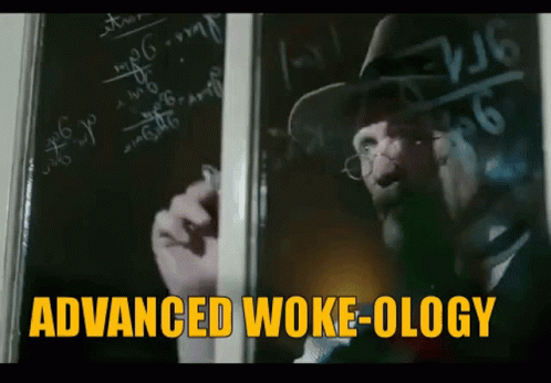 Man Writing on Blackboard Saying Advanced Woke-ology