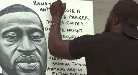 Man Writing On Poster Featuring George Floyd GIF