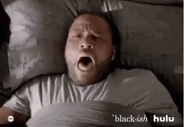 Man Yawning in Bed