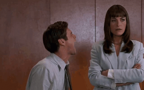 Man Yelling at Crossed Arms Woman