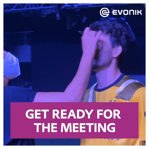 Man Yellow Black Shirt Hand on Forehead Evonik Logo
