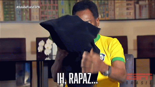 Man Yellow Shirt Covers Face With Black Pillow Saying Ih, Rapaz GIF