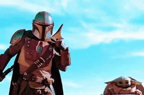 Mandalorian Sitting With Baby Yoda GIF