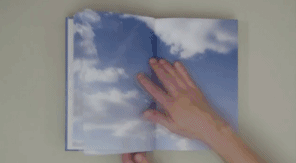 Manual Book Flip Cloud Movement GIF
