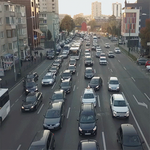 Many Cars Driving Down Street License Plate Starts With S GIF