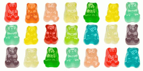 Many Different Colored Gummy Bears Are Lined Up In Rows GIF