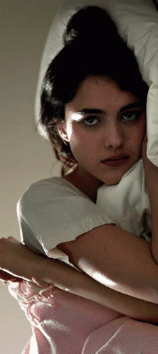 Margaret Qualley Lying In Bed GIF