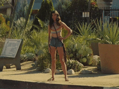 Margaret Qualley Pussycat Spinning On Sidewalk GIF