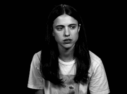 Margaret Qualley Touching Her Cheeks Black And White GIF