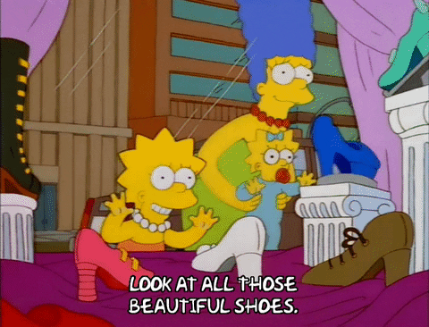 Marge Maggie Lisa Looking At Cartoon Shoes GIF