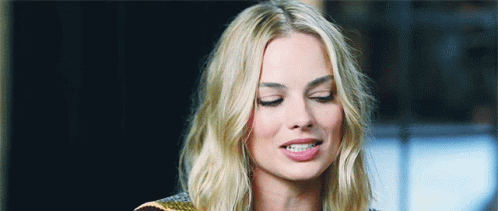 Margot Robbie Interview Coy Reaction GIF
