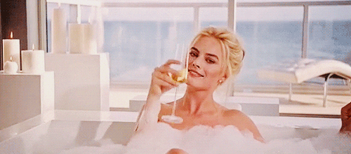 Margot Robbie Drinking Champagne And Enjoys Bubble Bath GIF