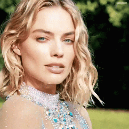 Margot Robbie Intrigued Looking Suspicious GIF