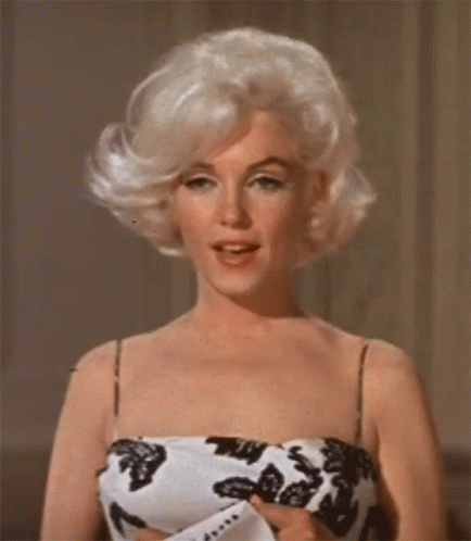 Marilyn Monroe Mouth Blowing Her Hair GIF