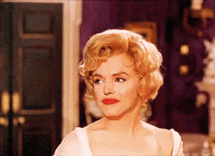 Marilyn Monroe Trying Not To Laugh GIF