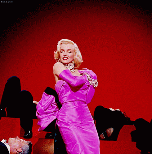 Marilyn Monroe Wink In A Pretty Pink Dress GIF