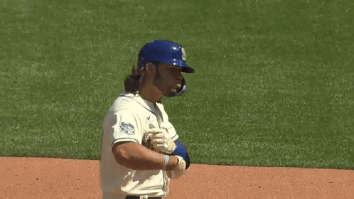 Mariners Baseball Player in Blue Helmet and White Jersey