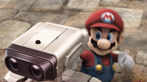Mario Standing Next to Small Robot