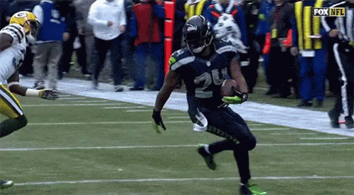 Marshawn Lynch Carrying Ball GIF