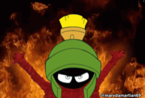 Marvin The Martian Is Standing In Front Of A Fire GIF