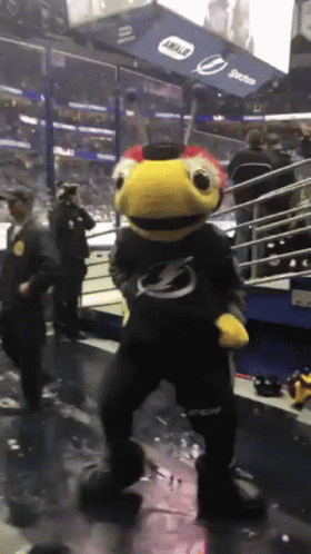 Mascot Dancing in Front of Intel Sign