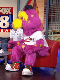 Mascot for the Indians Sitting on Red Chair