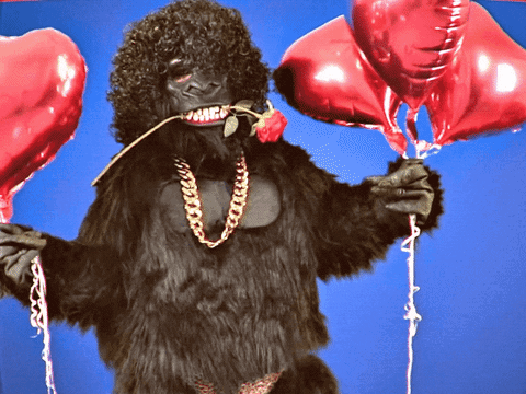 Mascot Gorilla Dancing With Heart Balloons GIF