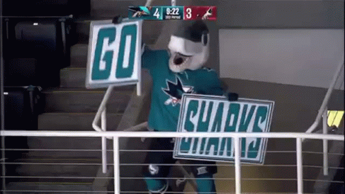 Mascot Holding Go Sharks Sign