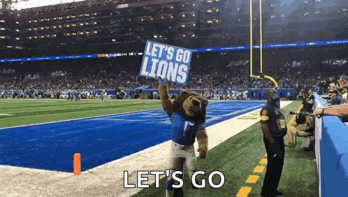 Mascot Holding Let's Go Lions Sign GIF