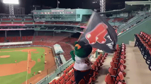 Mascot Holding Pizza Hut Flag