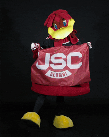 Mascot Holding Red USC Alumni Banner