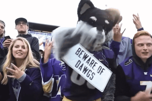 Mascot Holding Sign Saying Beware of Dawgs