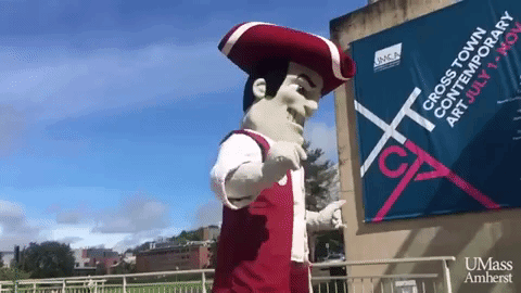 Mascot In Front Of Cross Town Contemporary Art Sign GIF