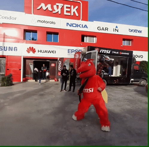 Mascot In Front Of Mtek Store GIF