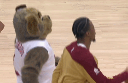 Mascot In Jersey Next To Basketball Player GIF