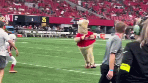 Mascot Running on Football Field