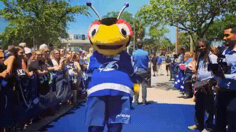 Mascot Standing On Blue Carpet GIF