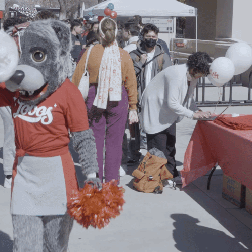 Mascot Wearing Loves Shirt in Crowd