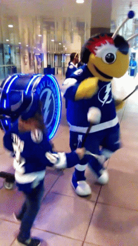 Mascot with Lightning Bolt Shirt Next to Bay Lightning Sign