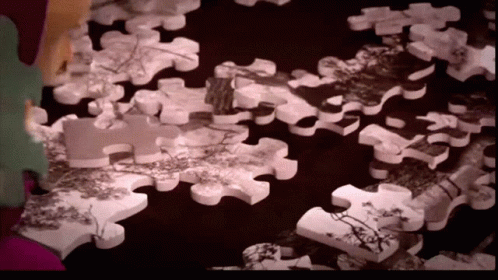 Masha Smashing Jigsaw Puzzle Pieces With Hammer GIF